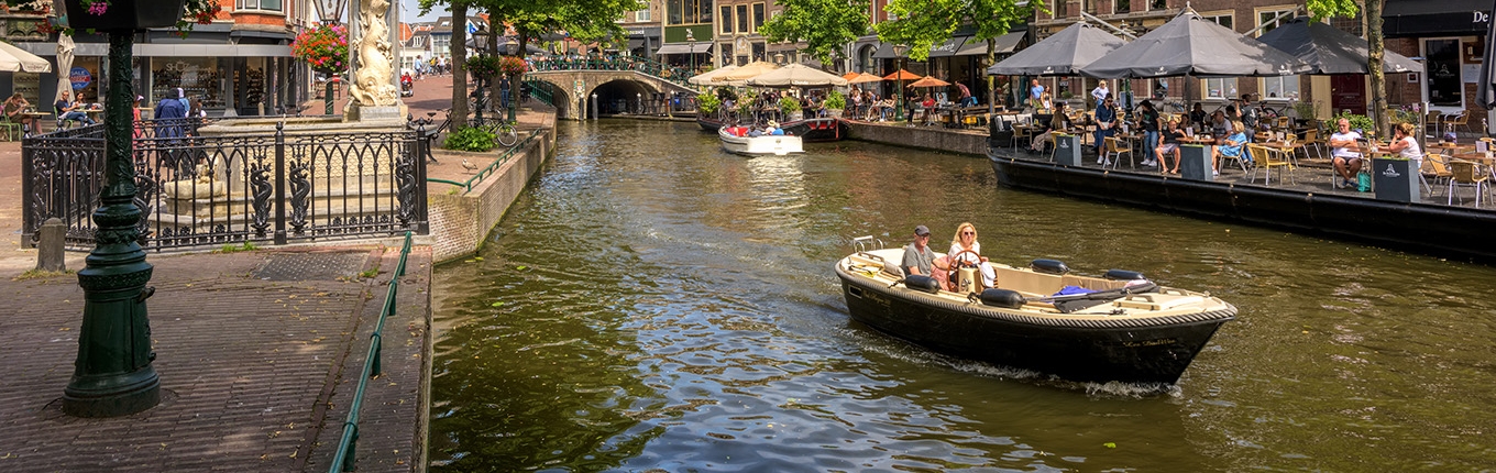 Boating on the canals in historical Leiden city center Boating on the canals in historical Leiden city center