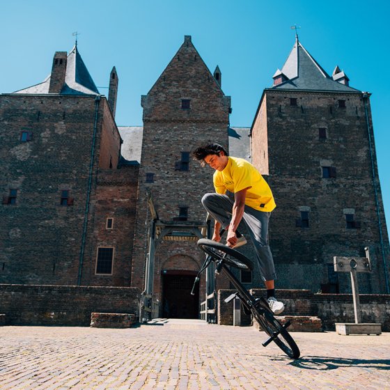 Sietse van Berkel stunts bikes in front of castle
