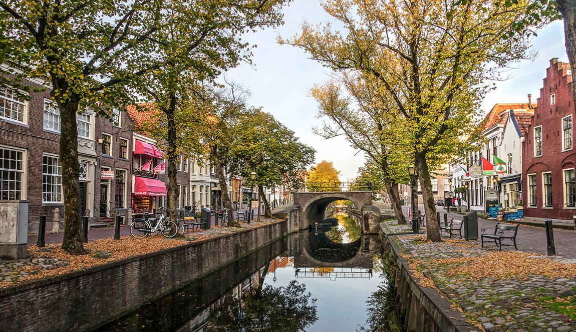 Edam view along canal towards Dam in autumn Edam view along canal towards Dam in autumn