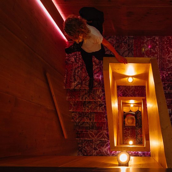 Lady walks down hotel stairs Utrecht