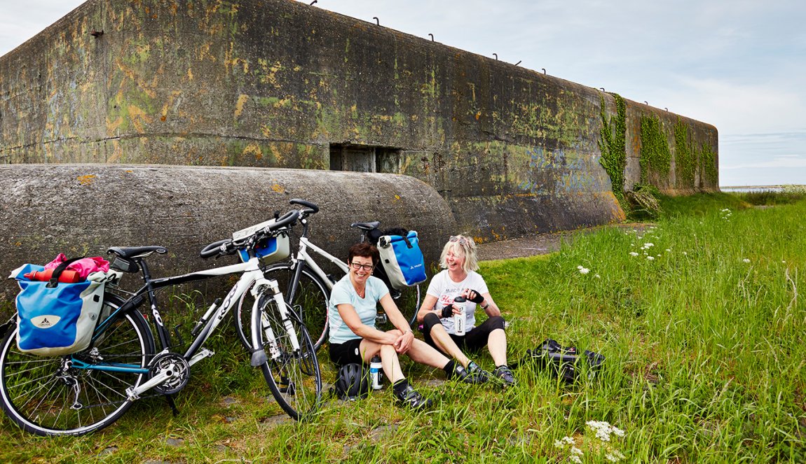 Cyclists take a break at the bunker on the Afsluitdijk