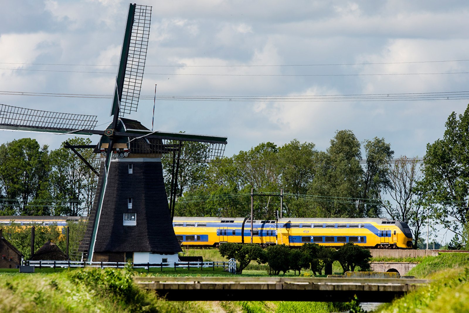 NS train through landscape with mill