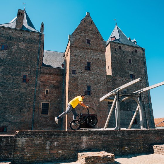 Sietse van Berkel stunts bikes on wall castle 