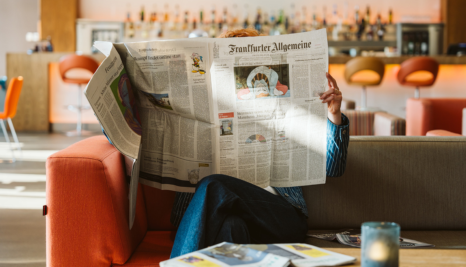 Lady reading German newspaper Frankfurter Allgemeiner Lady reading German newspaper Frankfurter Allgemeiner