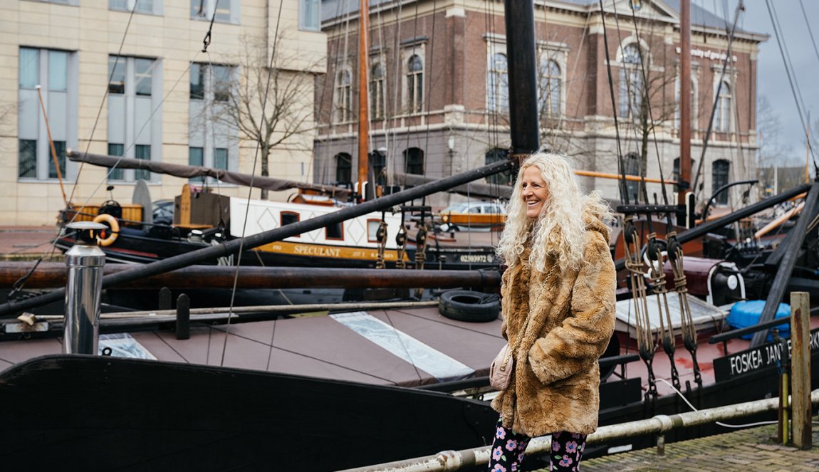 Portrait of Herma van Keulen, she stands in front of a ship Portrait of Herma van Keulen, she stands in front of a ship