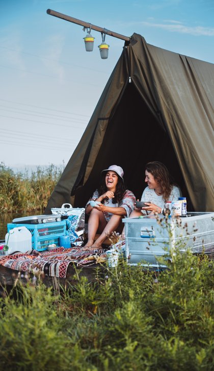 Ladies on a camping raft having fun