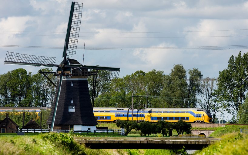 NS train through landscape with mill