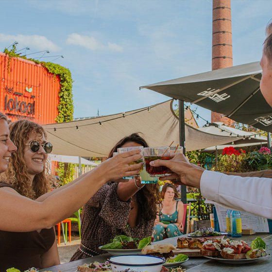 Visitors toast on terrace of Het Lokaal Amersfoort