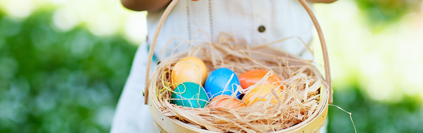 Girl with easter eggs in a basket Girl with easter eggs in a basket
