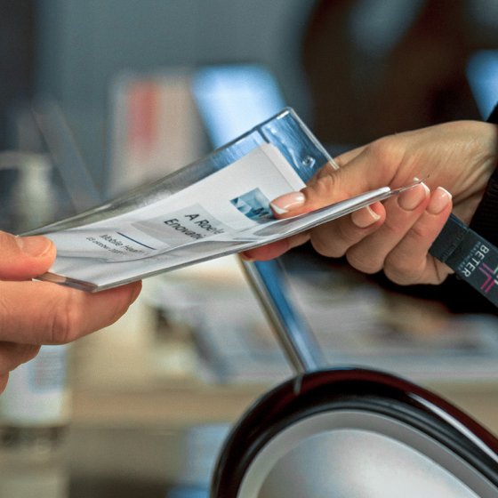 Handing over badge during Mobile Healthcare event