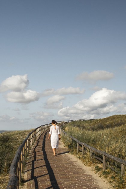 Woman at the Texel lighthouse in summer