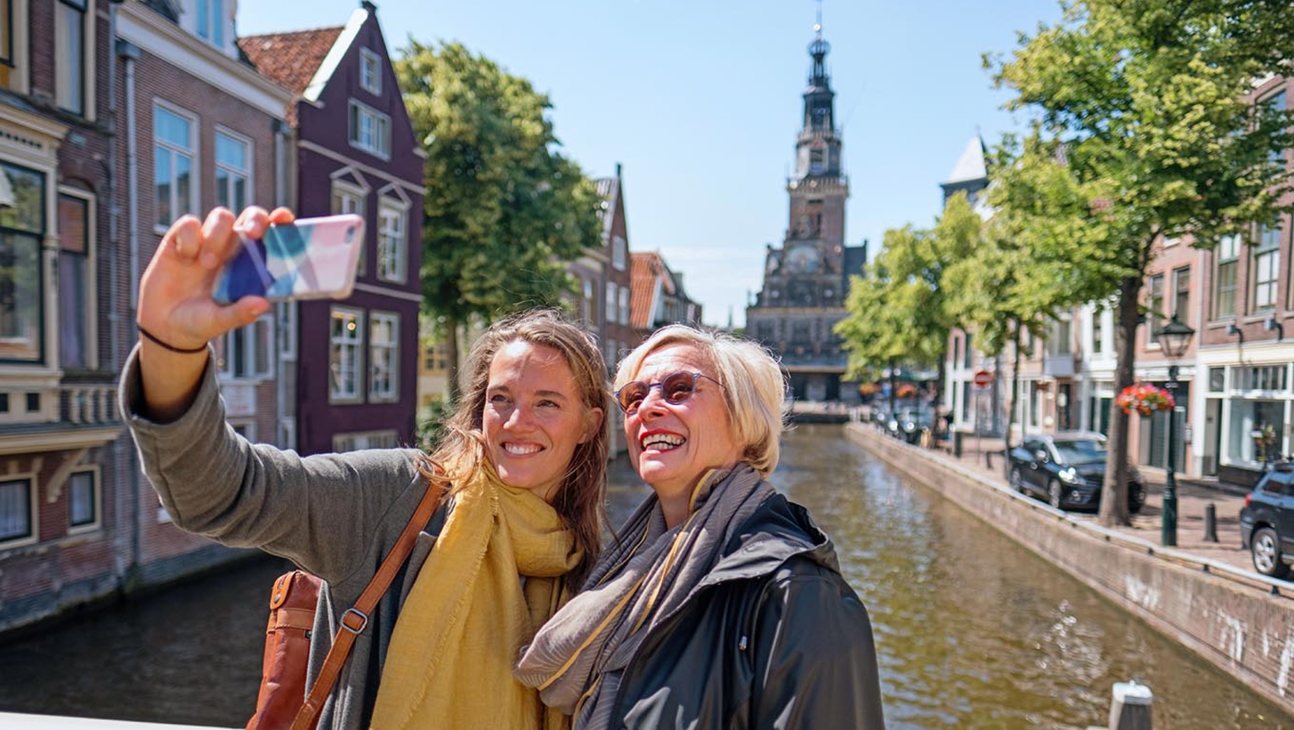 Two women making selfie on bridge in Alkmaar 