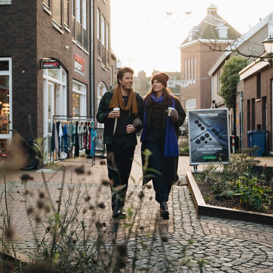 Couple exploring the streets of Ommen in Overijssel on an autumn day