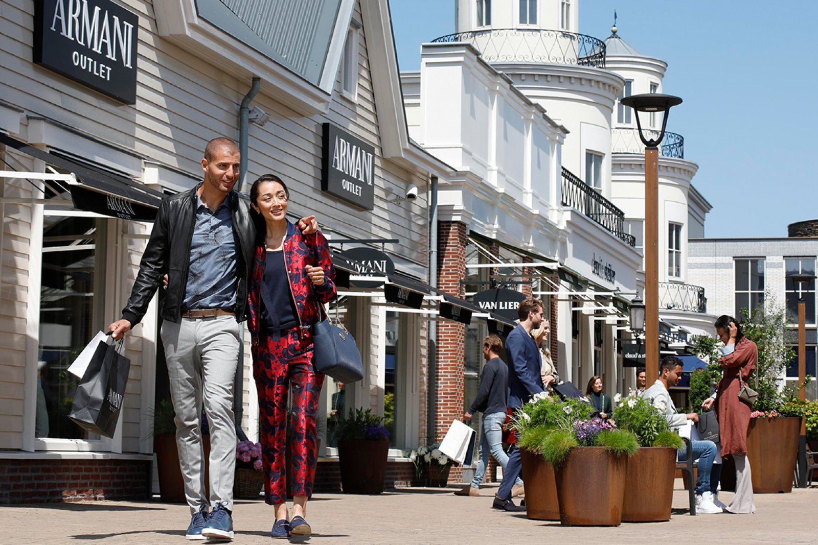 Batavia stad couple shopping at armani outlet