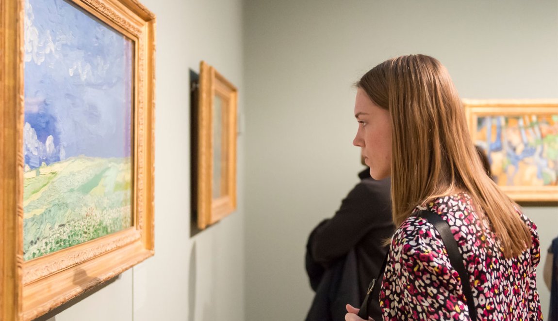 Women looking at a painting at the Van Gogh Museum in Amsterdam Women looking at a painting at the Van Gogh Museum in Amsterdam