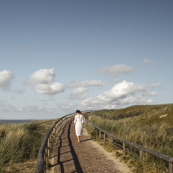 Woman at the Texel lighthouse in summer