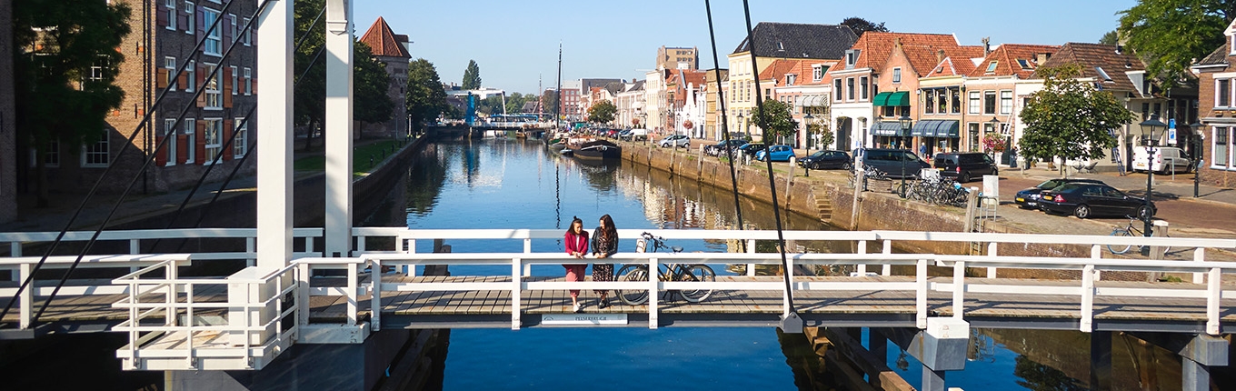 Hanseatic city of Zwolle ladies on Pelserbrug over Thorbeckegracht