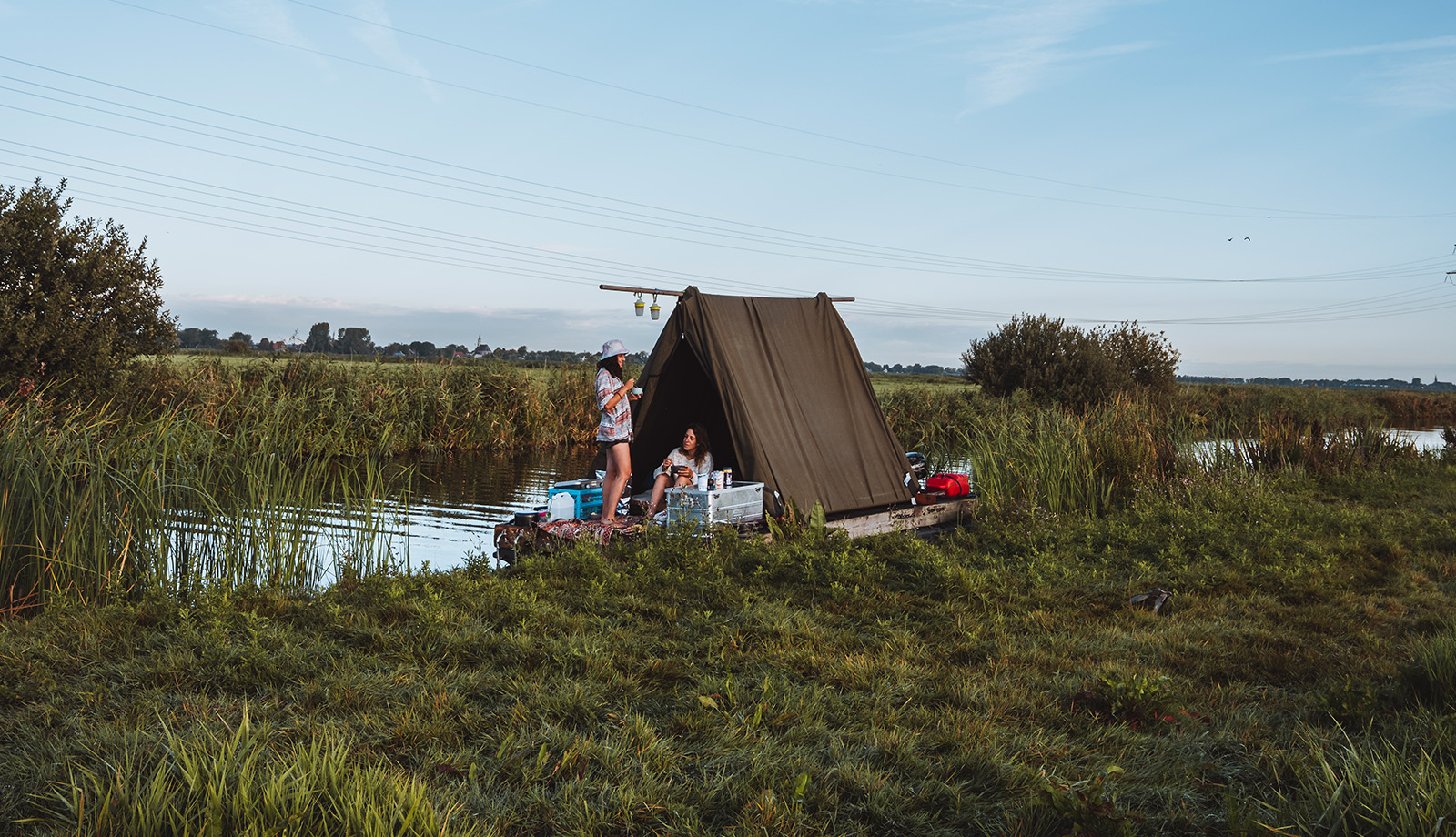 Two ladies on their raft from Flotten in the meadow near Waterland