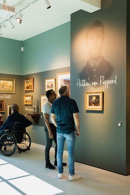 Van Gogh Village Museum visitors view paintings