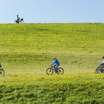 Cyclists on the embankment