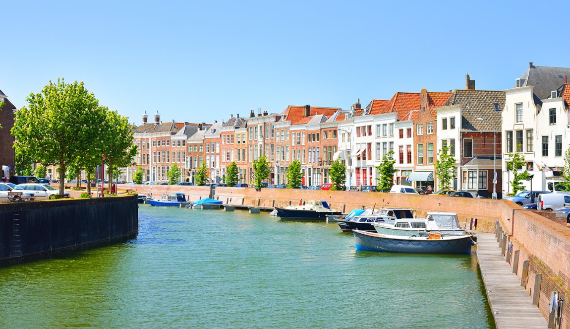 View of Middelburg with beautiful houses and boats along the canal.