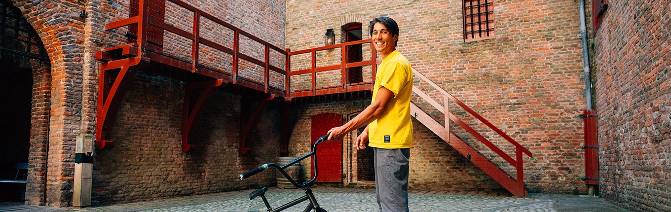 Sietse van Berkel with bicycle in courtyard Sietse van Berkel with bicycle in courtyard