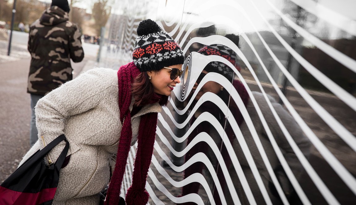 Woman looks through peephole Depot Boijmans Van Beuningen Rotterdam