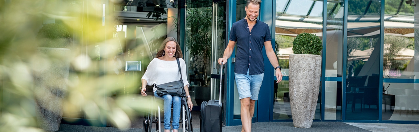 Couple after visiting Sanadome Hotel & Spa Nijmegen. Lady is in a wheelchair.