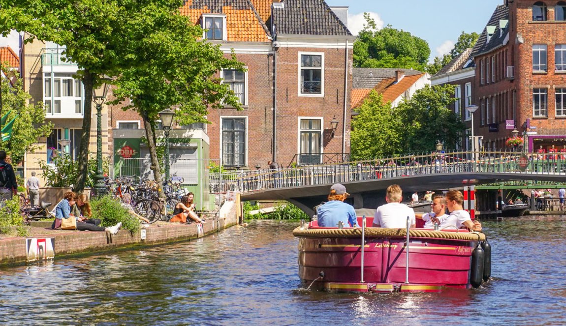 People in boat on canal in Leiden