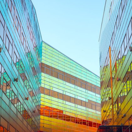 Colorful glass office building in the center of Almere La Defense. Dutch tax office.