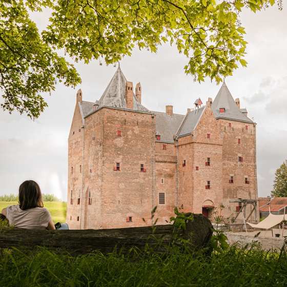 Enjoying a moment on a bench at Loevestein Castle