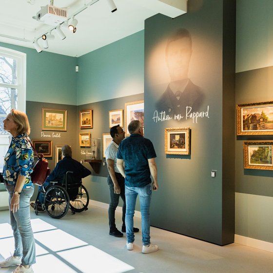 Van Gogh Village Museum visitors view paintings