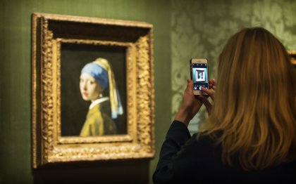 Girl taking photo of Girl with Pearl Earring at Mauritshuis The Hague