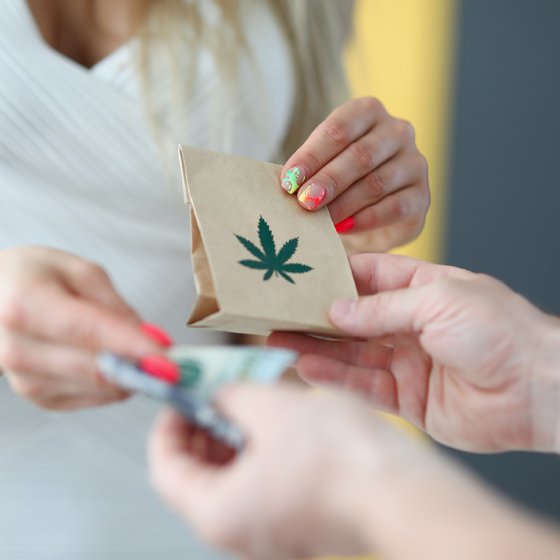 Customer purchasing a cannabis product at a Dutch coffeeshop
