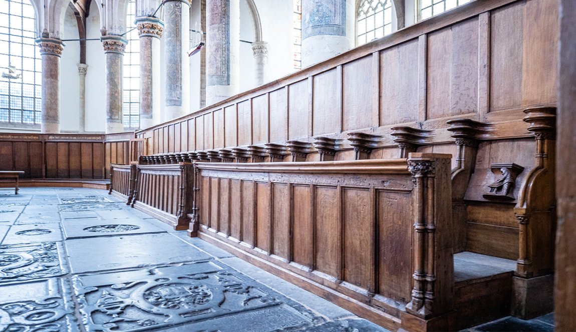 Interior with wooden church pew Oude Kerk Amsterdam Interior with wooden church pew Oude Kerk Amsterdam