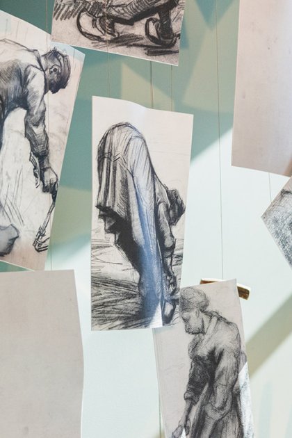 Van Gogh Village Museum lady looks at details