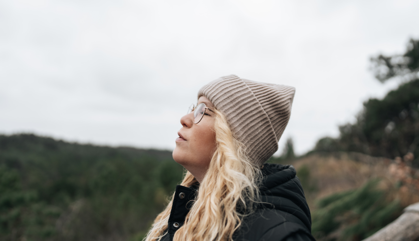 Woman enjoying the fresh air in the dunes