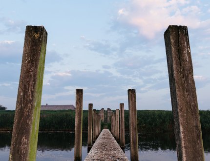 Hollandse Waterlinie jetty with wooden posts to bunker on Diefdijk Hollandse Waterlinie jetty with wooden posts to bunker on Diefdijk