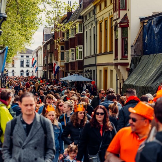Crowd in orange celebrating Kingsday in Utrecht