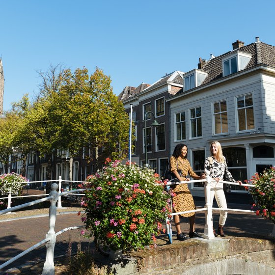Ladies look out over Delft canal