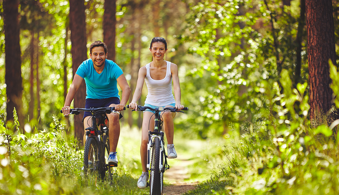 Couple riding bicycles Couple riding bicycles