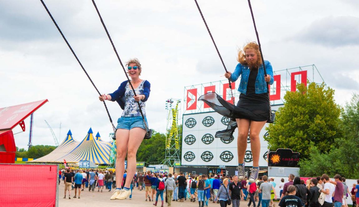 Two girls at Festival Lowlands on a swing