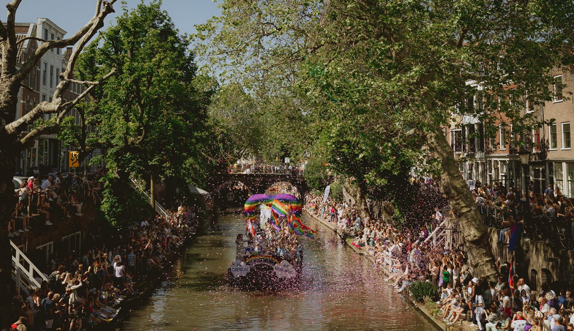 Utrecht Pride boat through canal with confetti