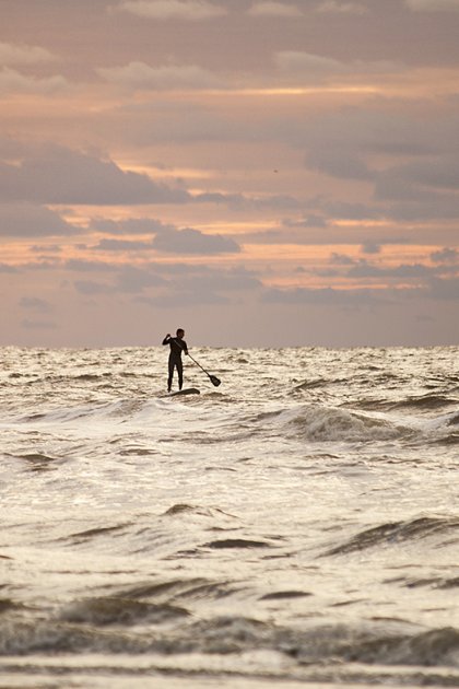 Supper on rough sea in evening near coast of South Holland