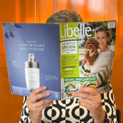 Belgium press colleague reading magazine