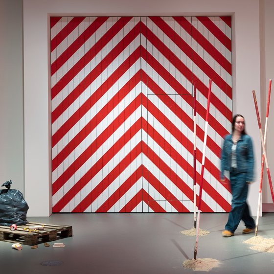 Visitor exploring an art installation about landscape change at Stedelijk Museum Breda