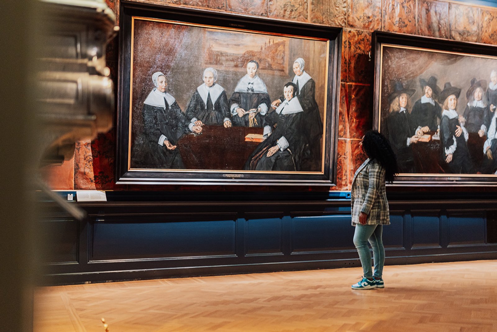 Lady looks at paintings in Haarlem Frans Hals Museum 