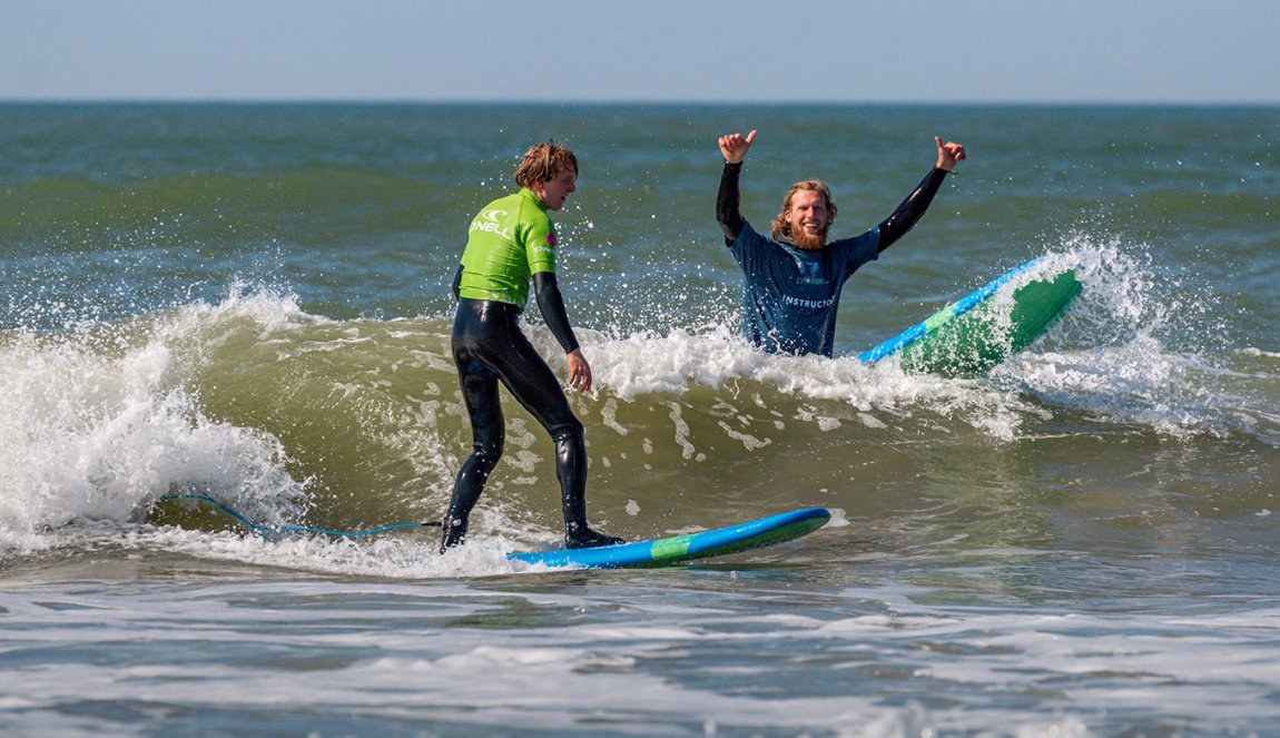 Instructor with student surfer in Zandvoort