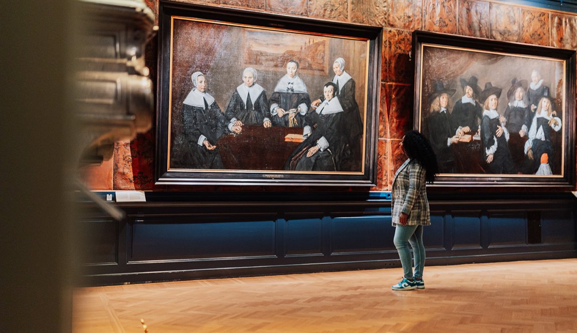 Lady looks at paintings in Haarlem Frans Hals Museum 