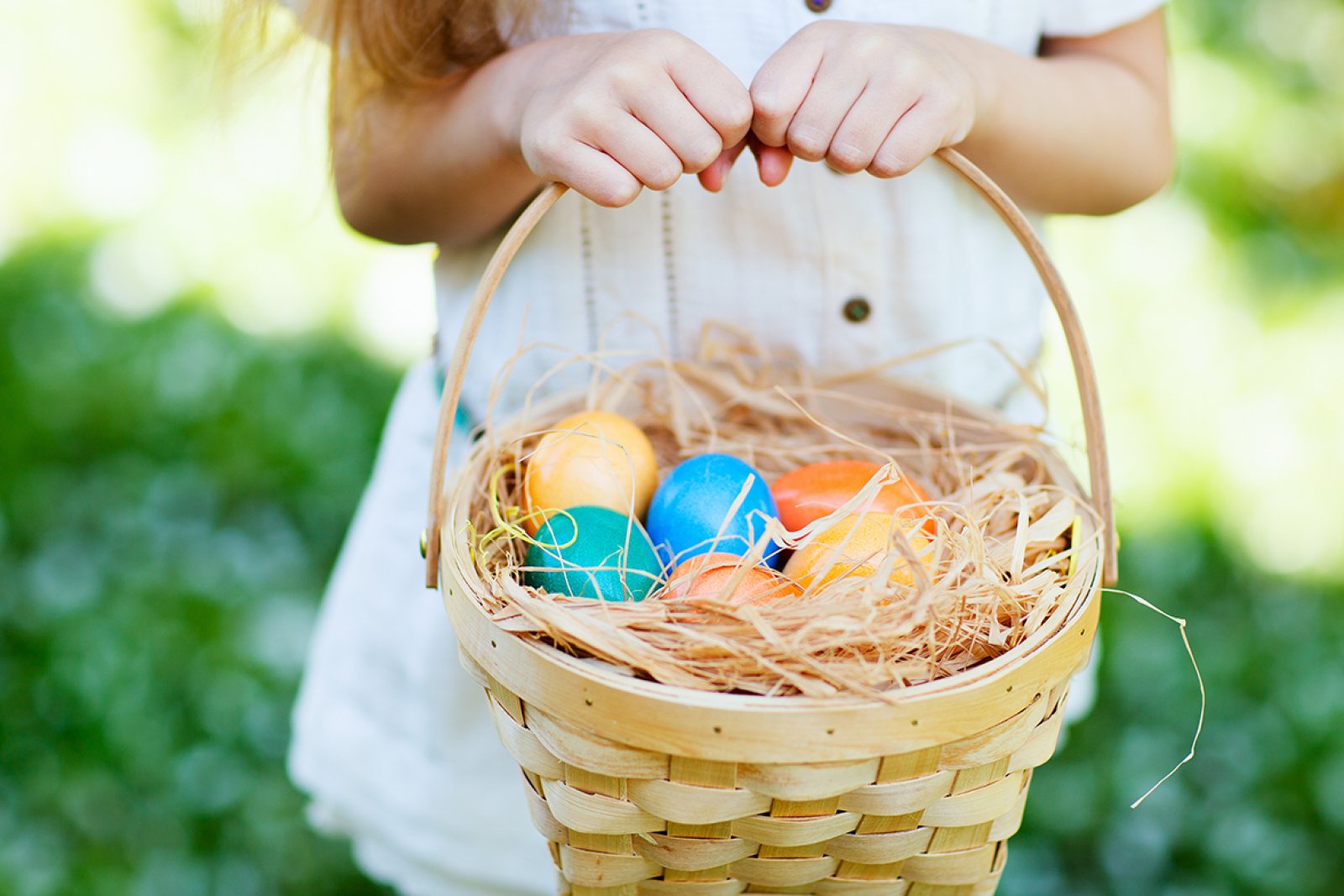 Girl with easter eggs in a basket
